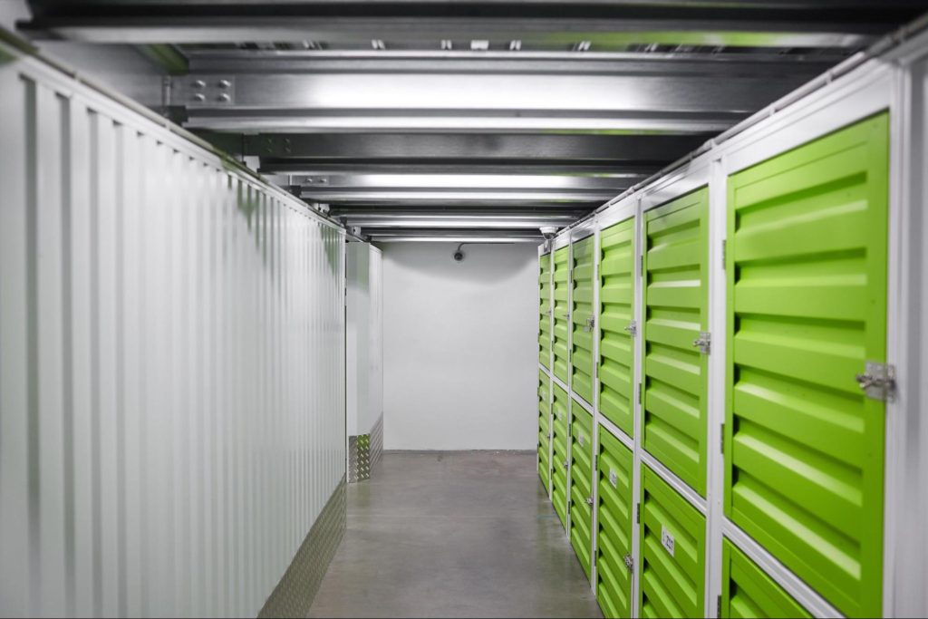 A modern temperature-controlled storage room with yellow-green aluminum cabinet doors. 
